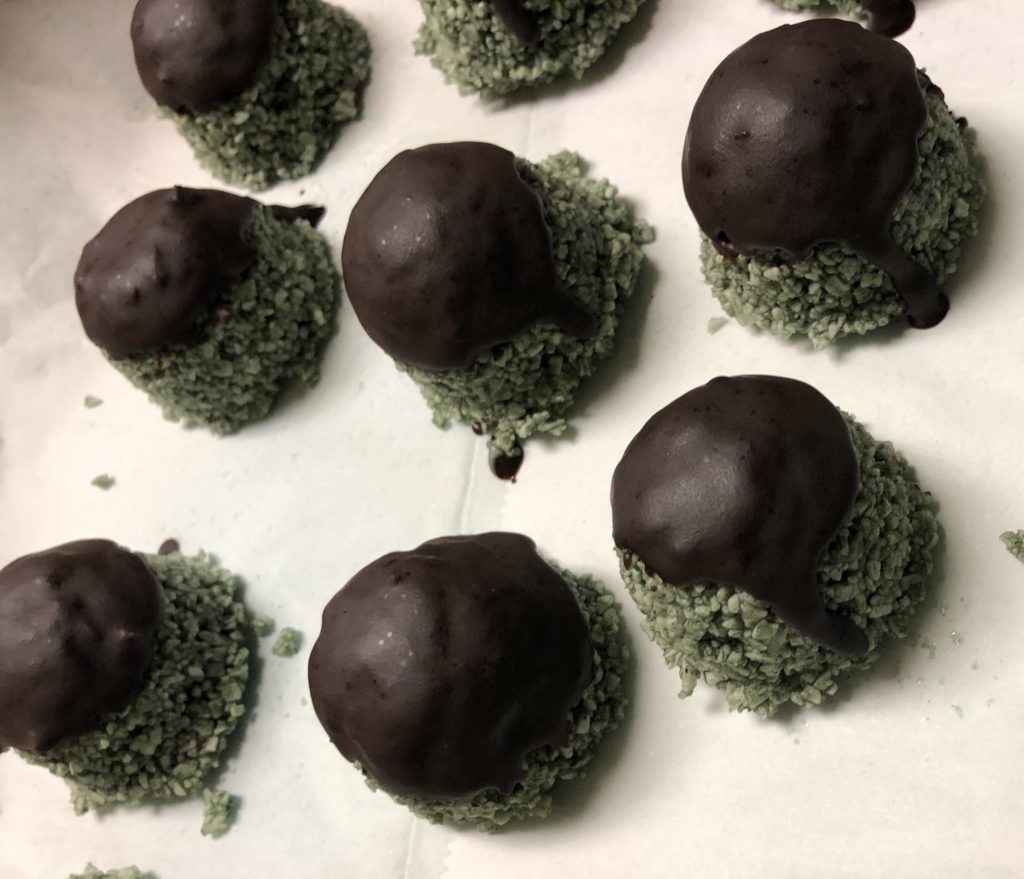 raw superfood macaroon dipped in chocolate