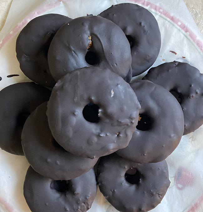 pile o'cake donuts covered in chocolate